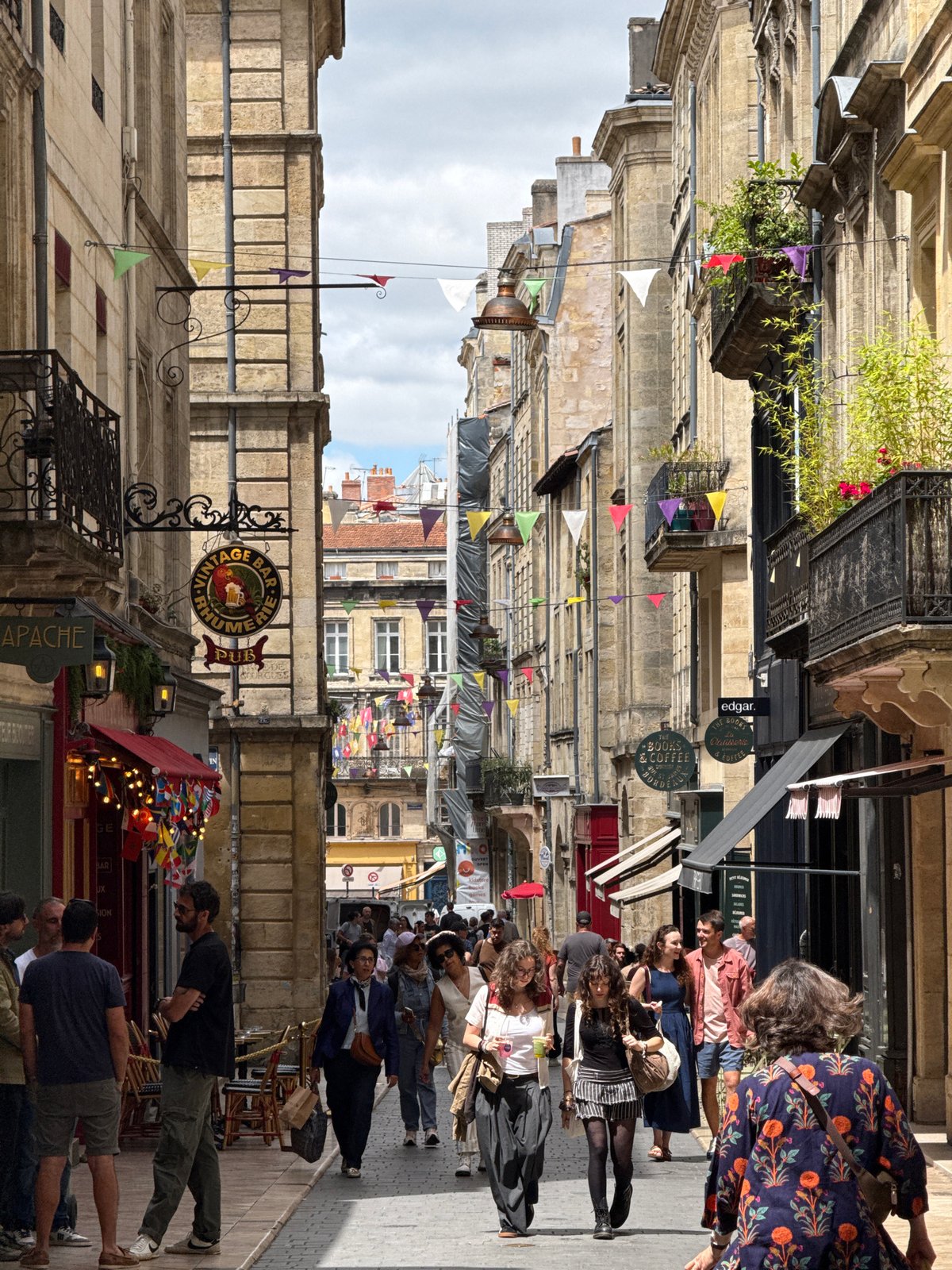 Tourist captures historic Bordeaux landmarks during afternoon walking tour