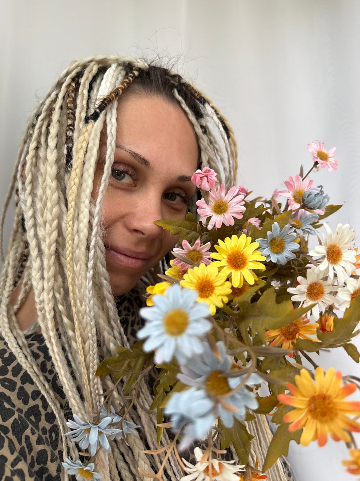Blonde braids and leopard print in a Rusanovo photo session