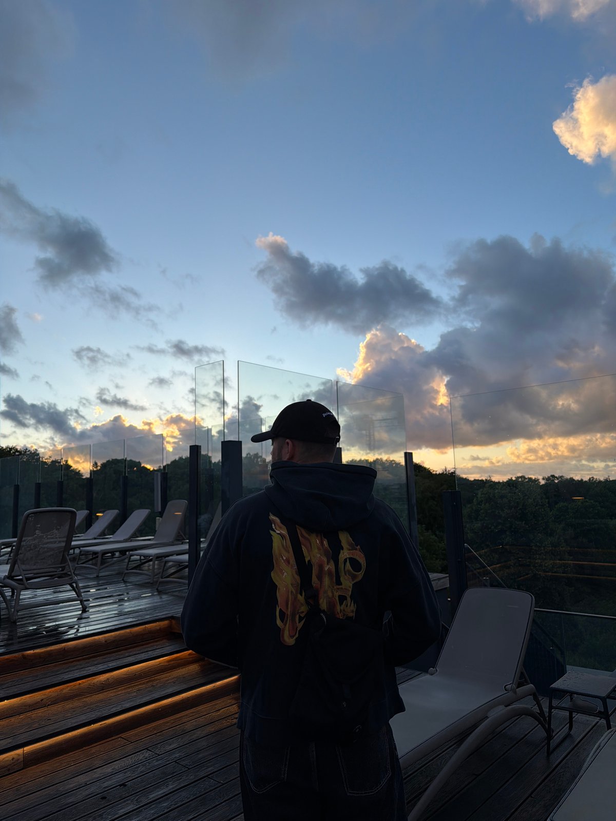 Sunset rooftop terrace overlooking Kołobrzeg cityscape