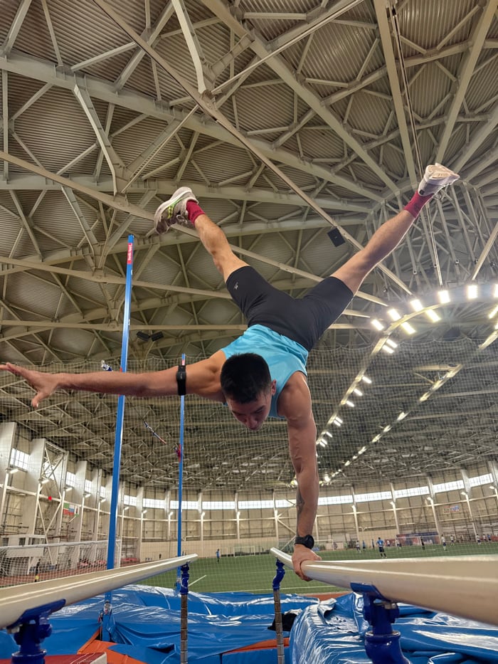 Gymnast practices parallel bars routine in Russian facility
