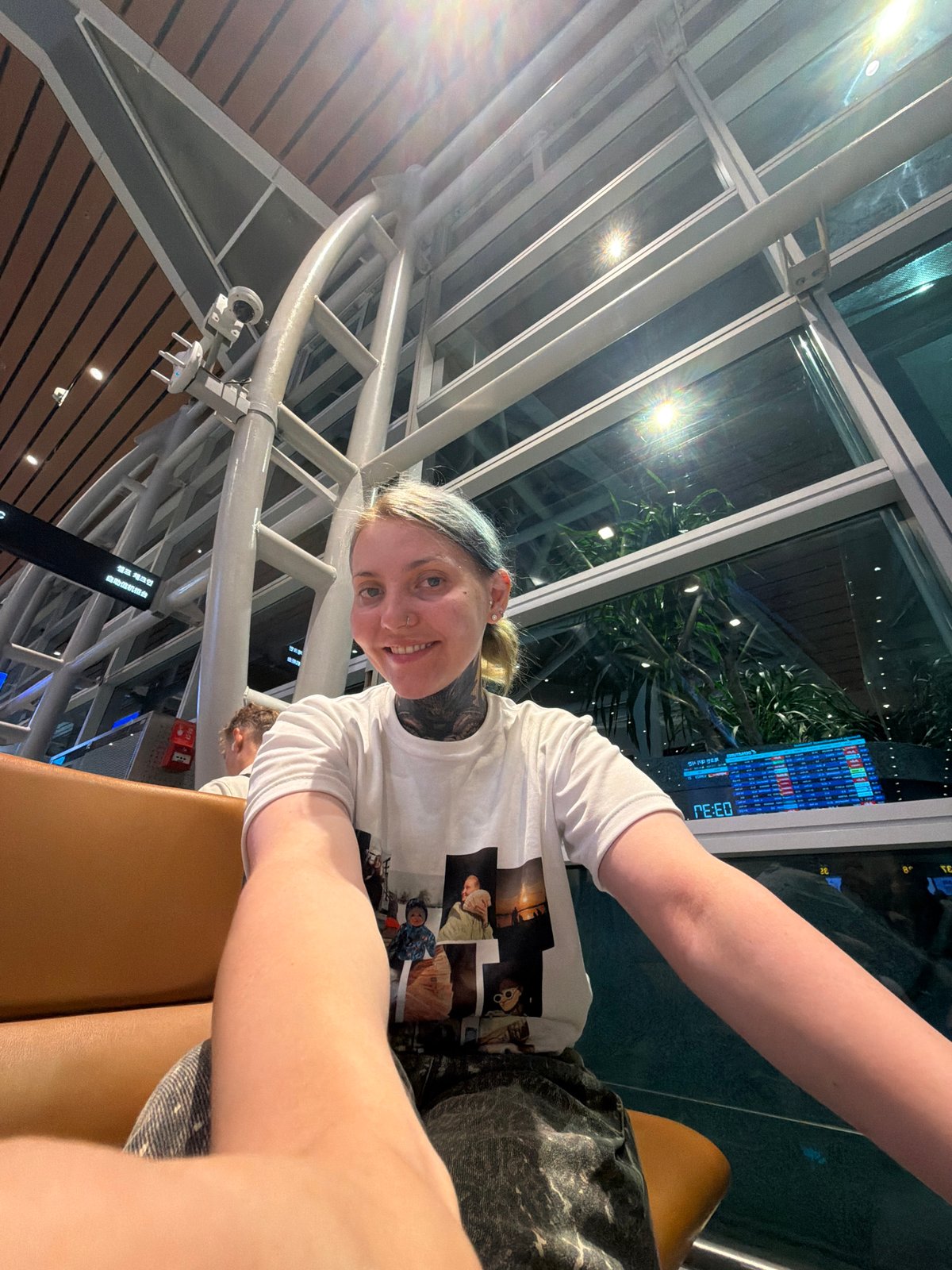 Family travels through Da Nang airport terminal evening