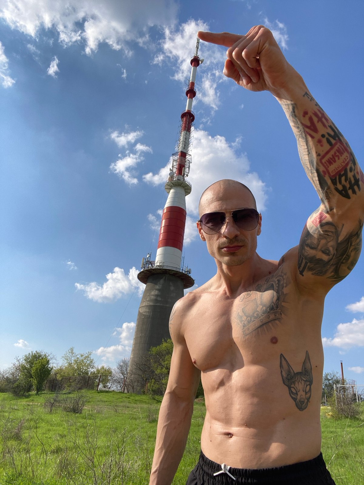 Man points at Pleven TV Tower in Bulgaria