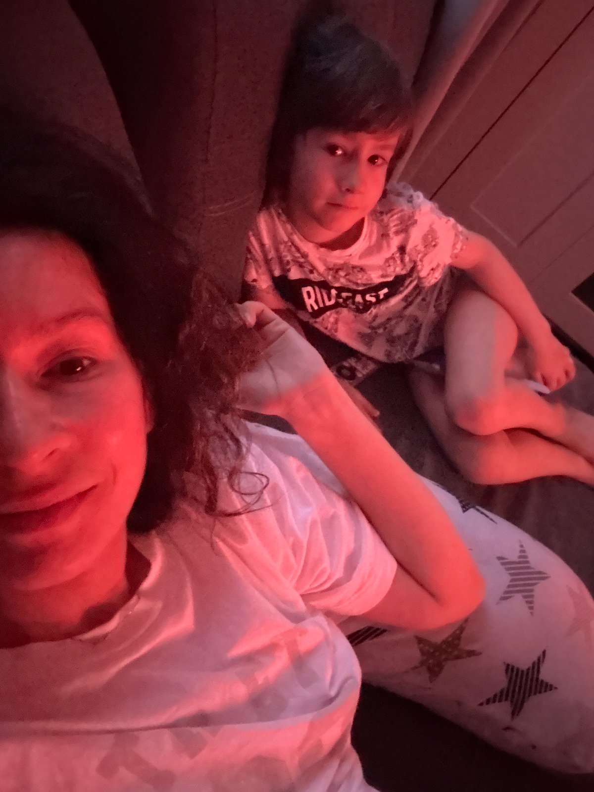 Mother and child enjoy quiet afternoon watching cartoons in Chaikovsky