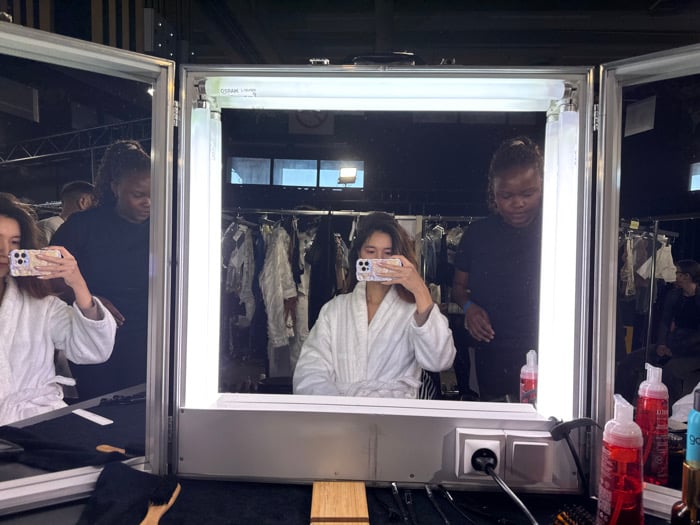 Fashion show backstage preparation captured in Paris area