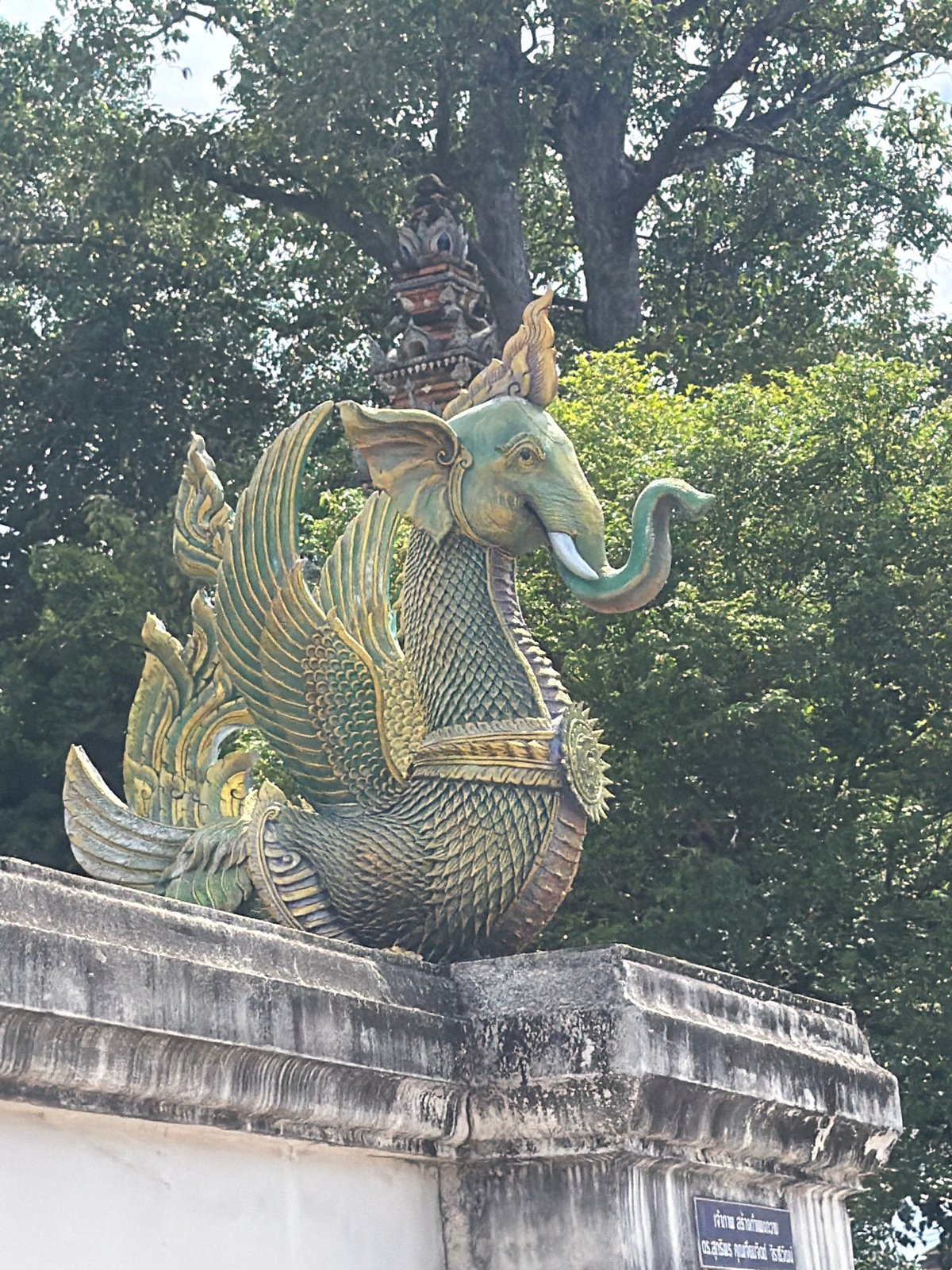 Ornate mythical sculptures at a Thai temple entrance in Ban Ko Klang