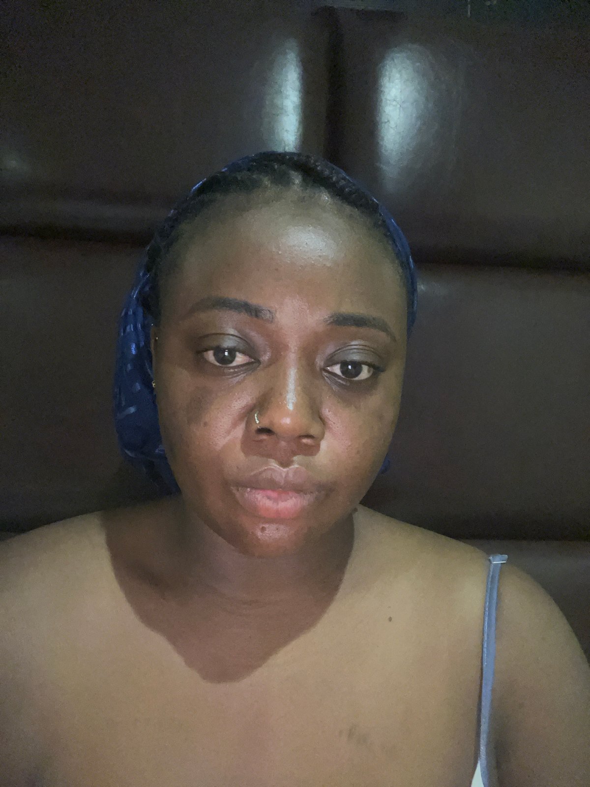 Woman captures selfie session in Abuja home setting