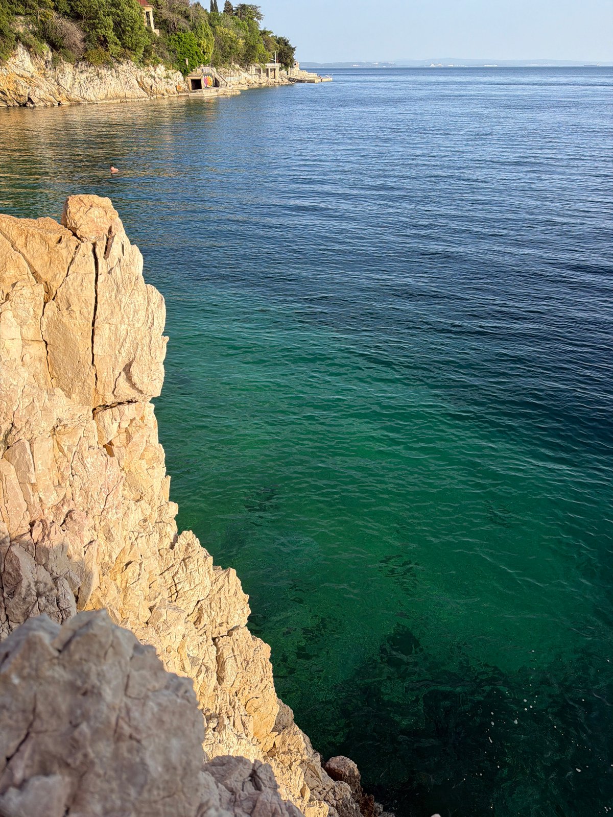 Coastal life documented in Rijeka during sunny afternoon