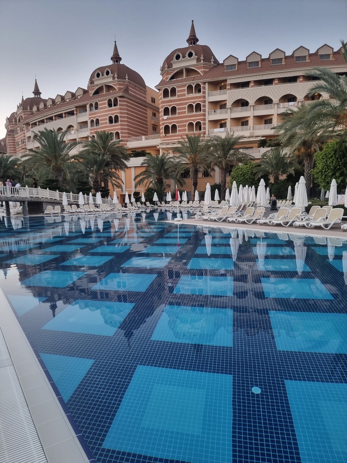 Dusk at a grand resort pool in Manavgat, Turkey