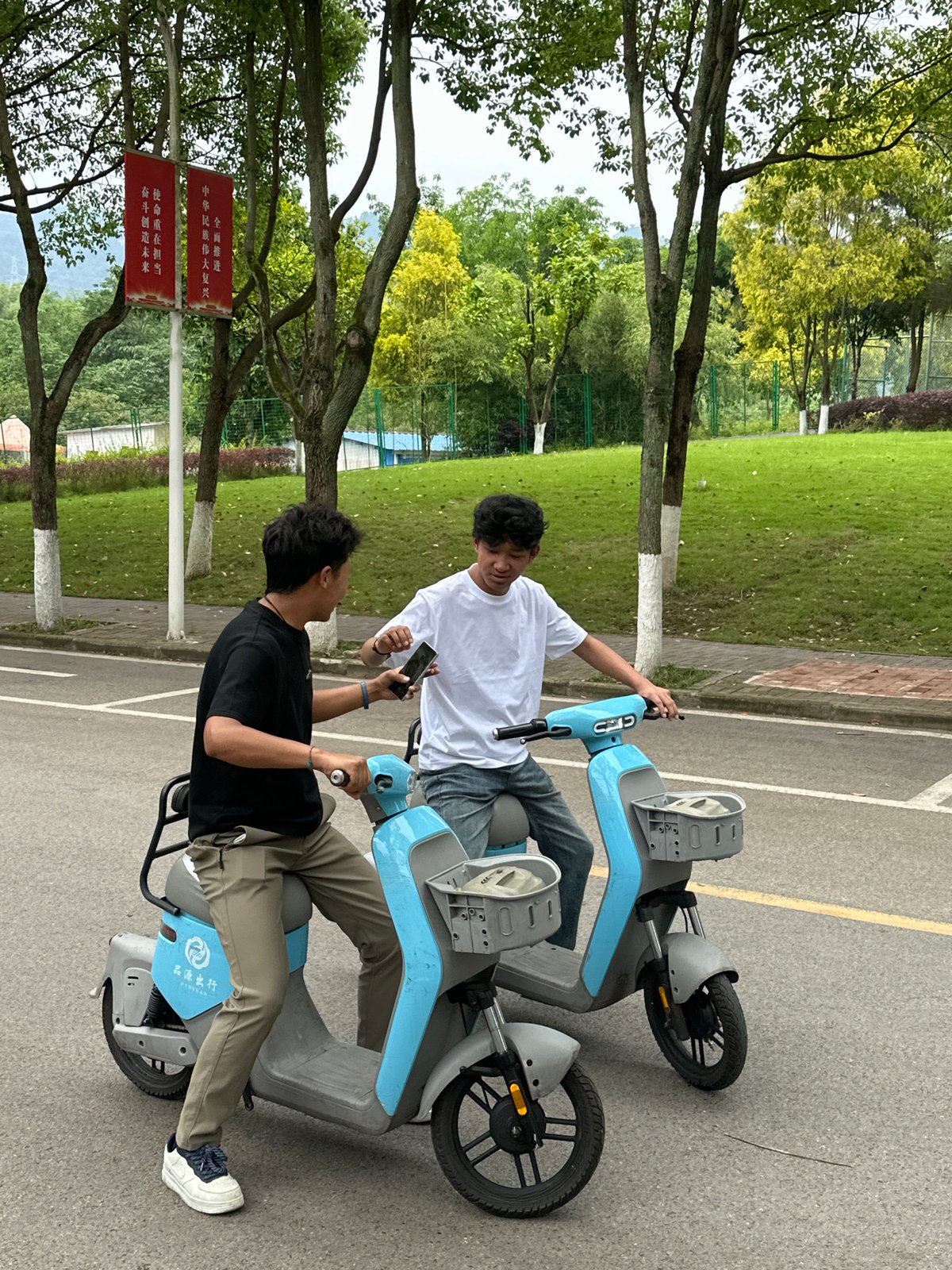 Young people gather outdoors in Jiangjin during May Day morning