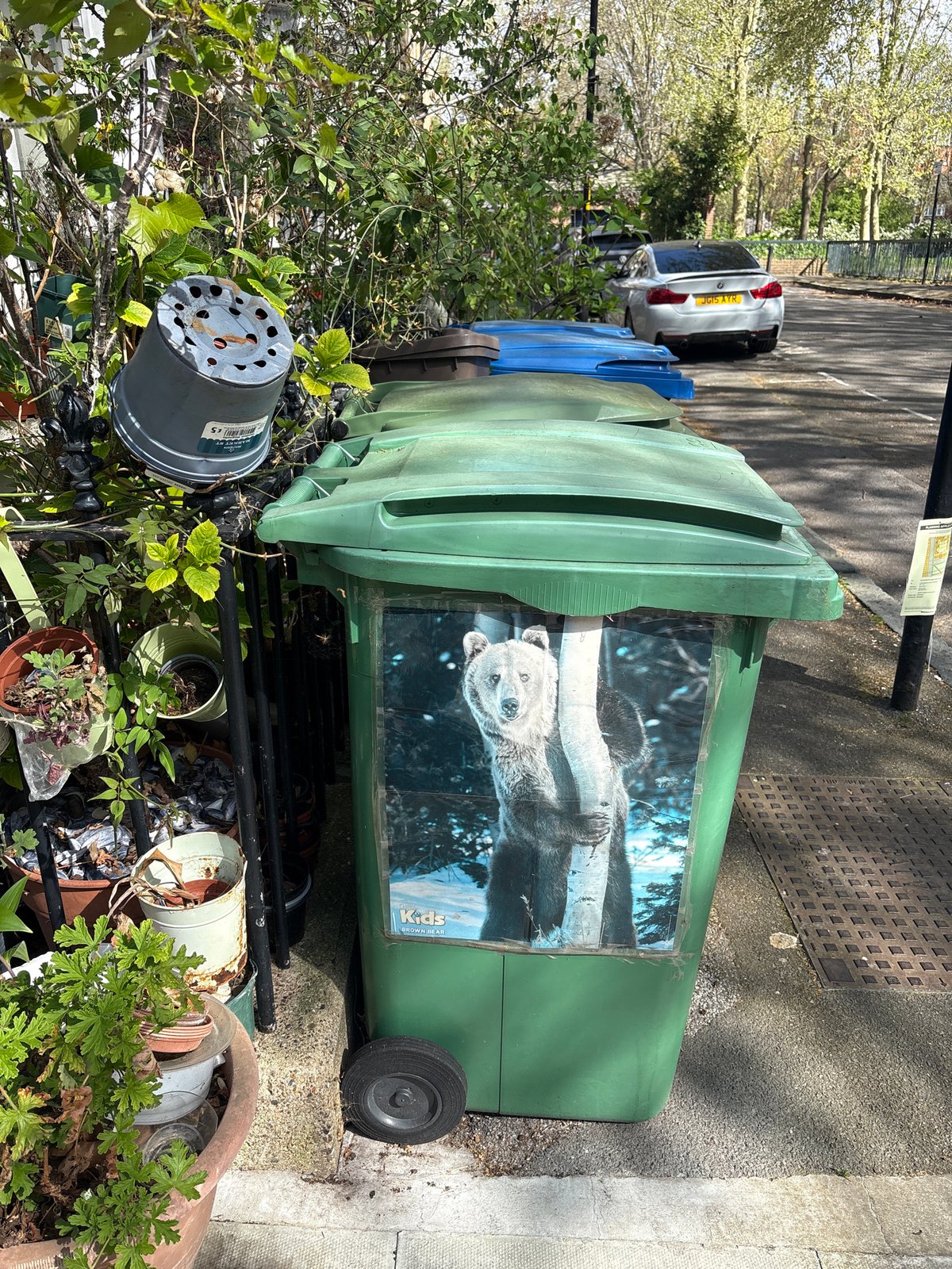 London residents document decorated bin and brick building