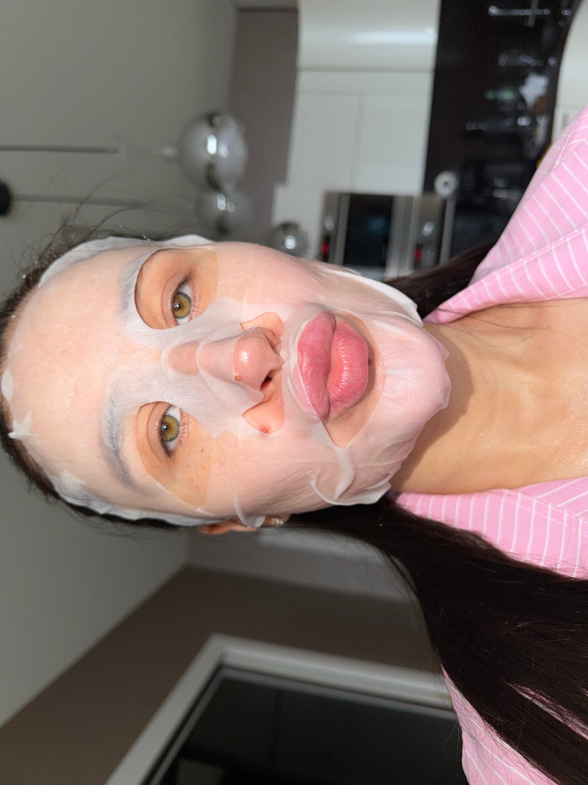 Woman performs early morning skincare routine in Khimki, Russia