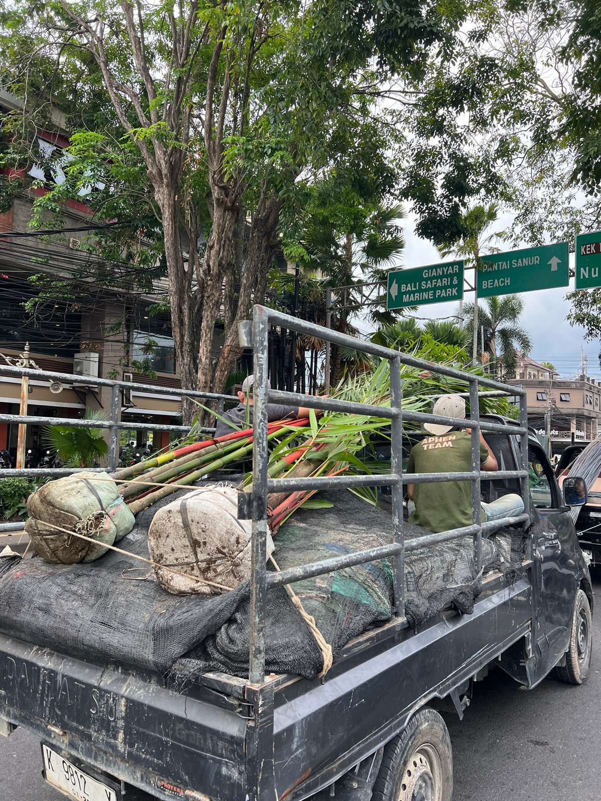 Morning traffic and temple architecture on Denpasar streets