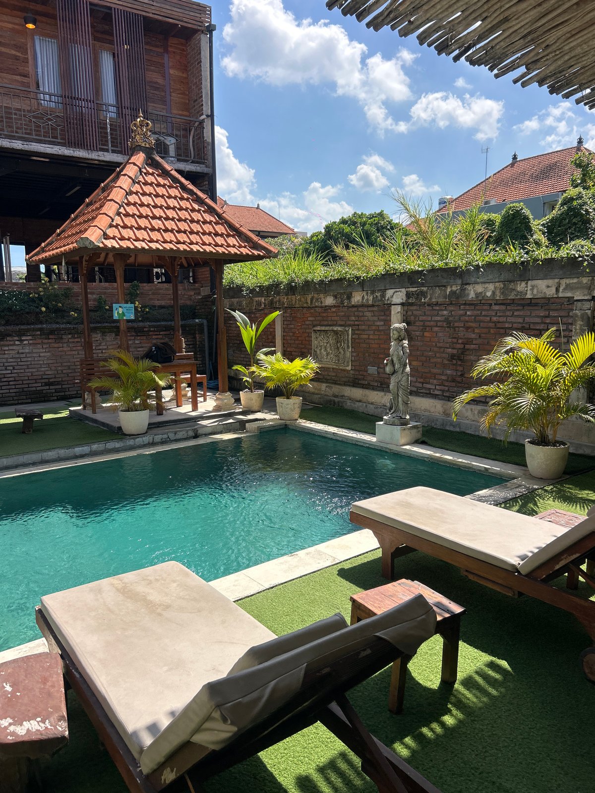 Resort pool, open-air gym, and Bali streets in North Kuta