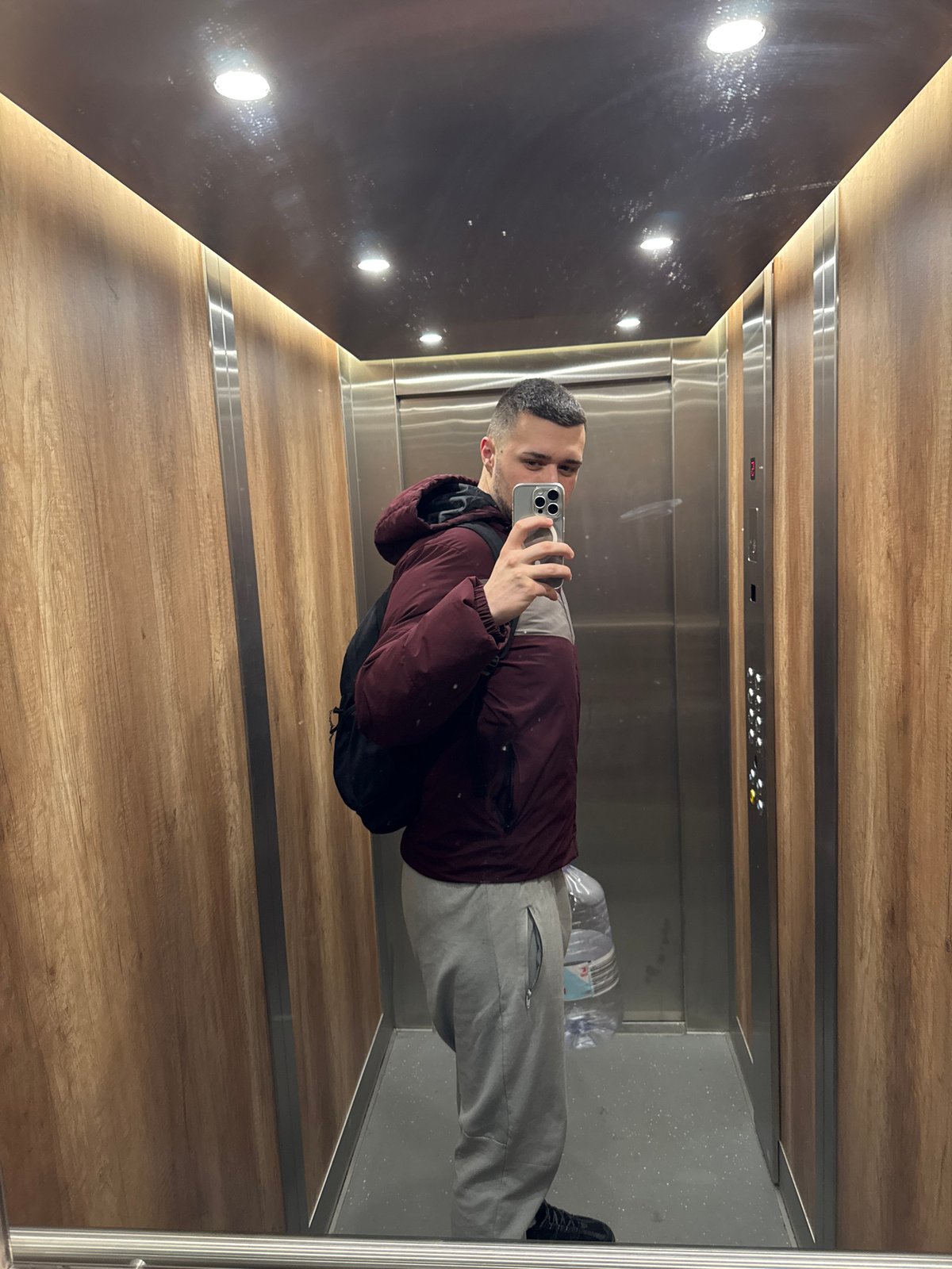 Man takes elevator selfie during overcast morning in Sofia