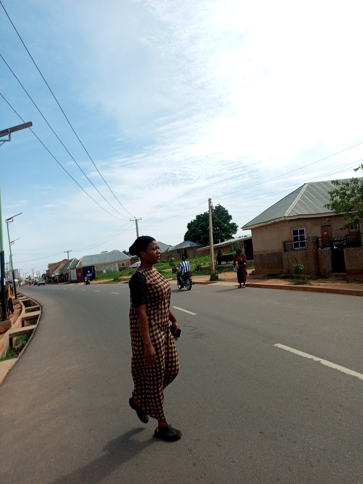 Morning street life along a road in Tempure, Nigeria