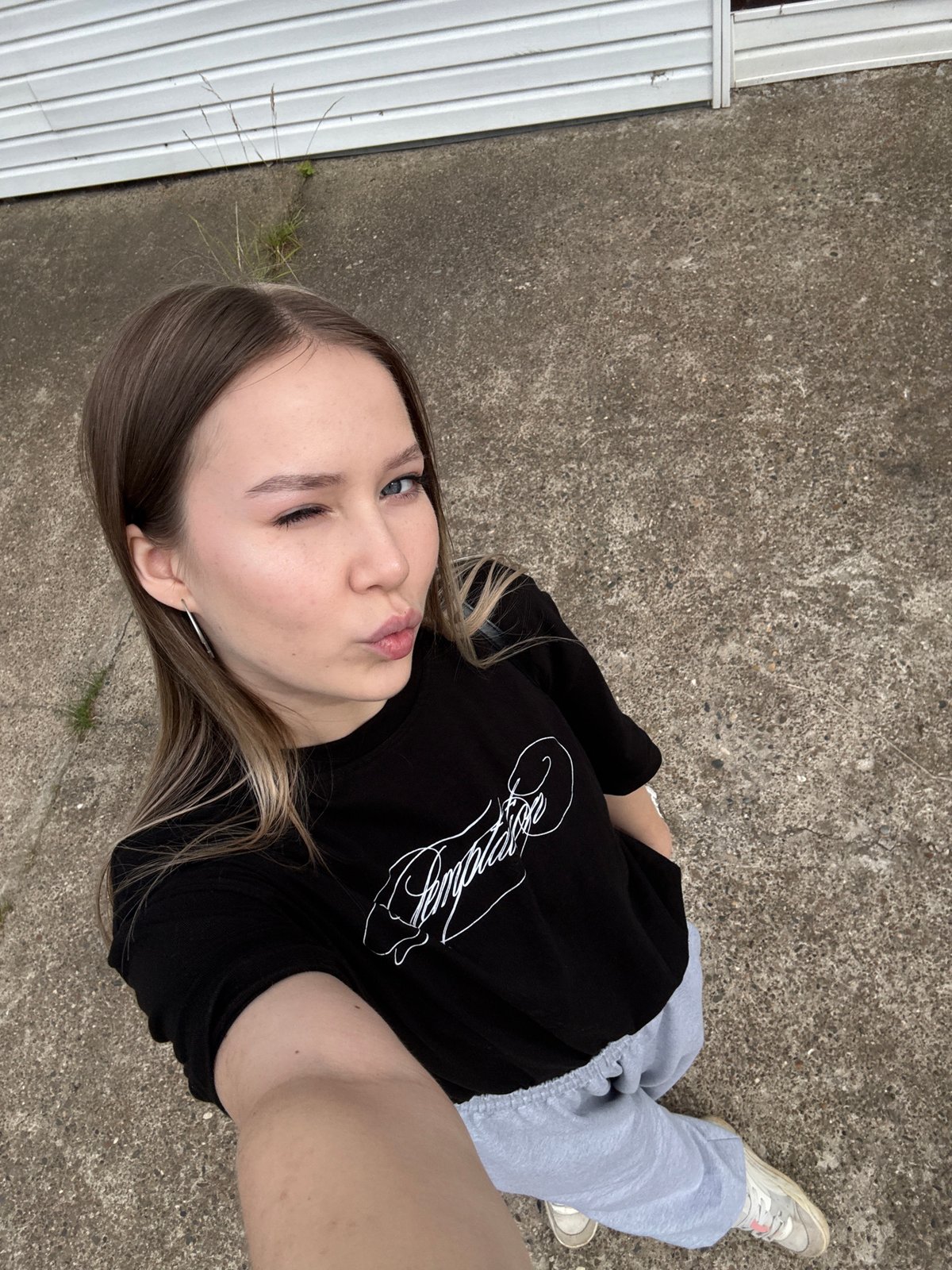 Friends in matching black tees hang out across Chaikovsky