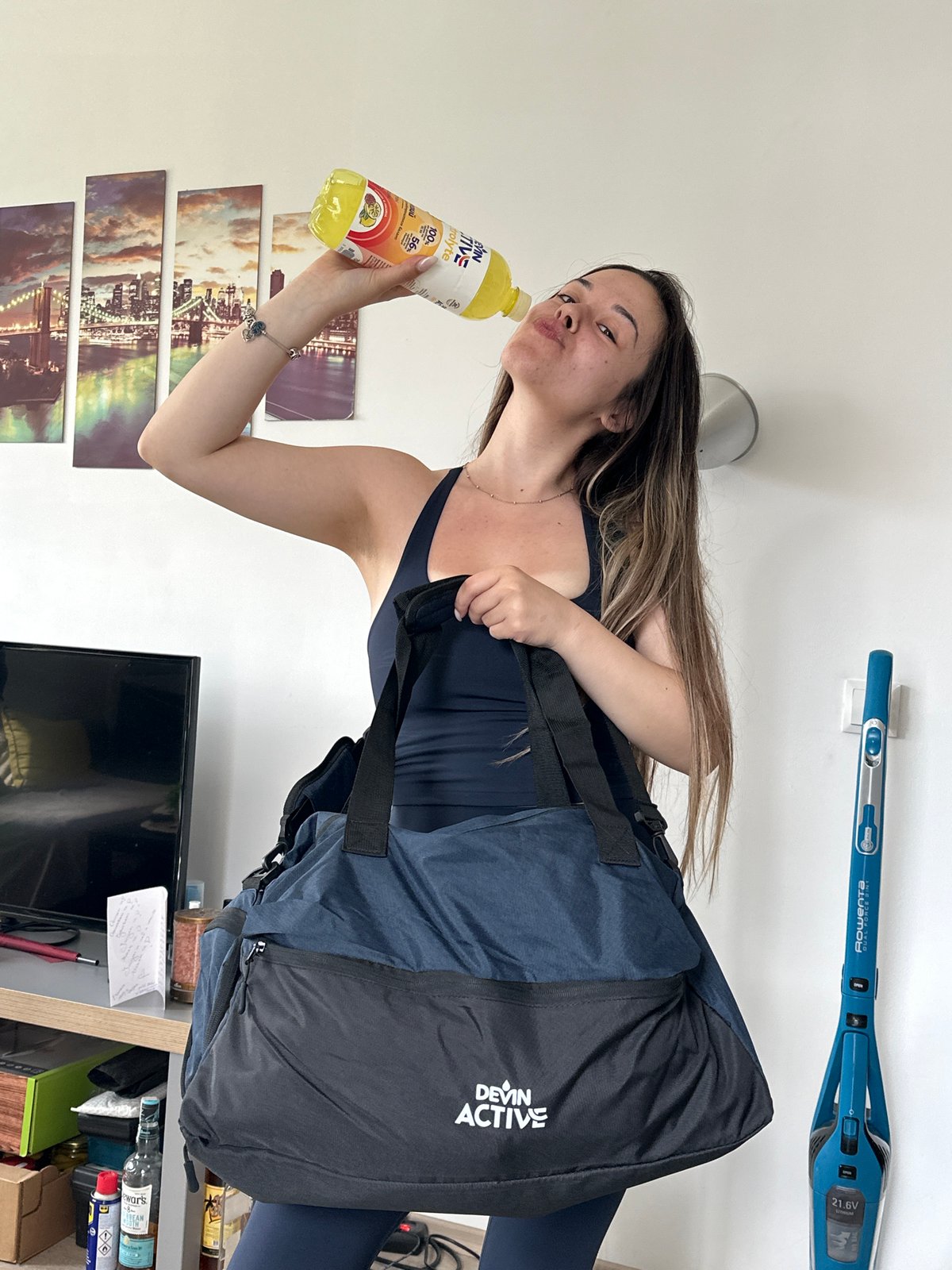 Woman with electrolyte drink spotted in athletic wear in Sofia