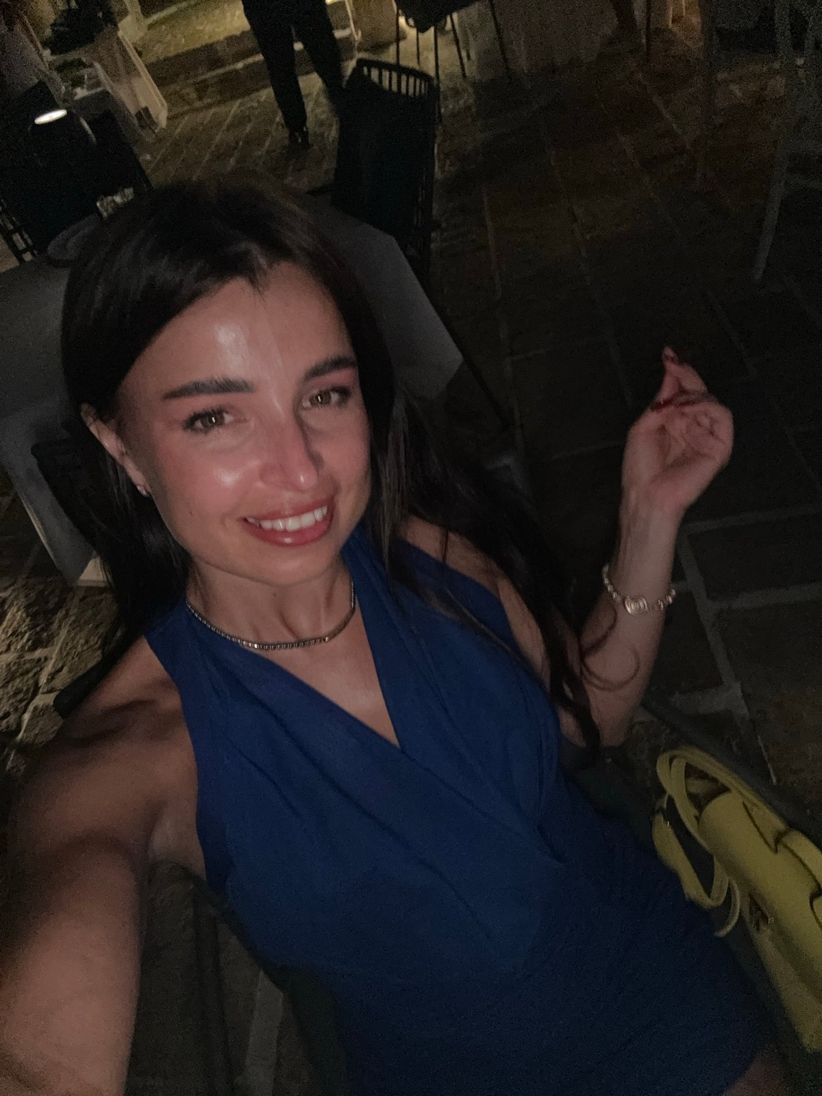 Night out at a stone courtyard restaurant with a seafood spread