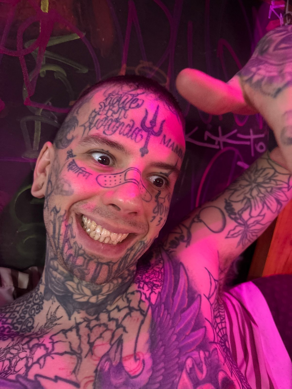 Heavily tattooed individuals photographed together in Buenos Aires