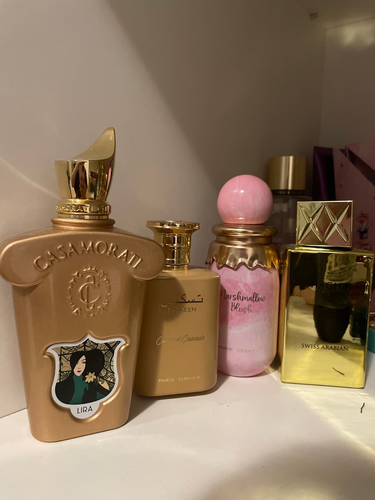 Indoor scenes: perfume display and sunset window reflection captured
