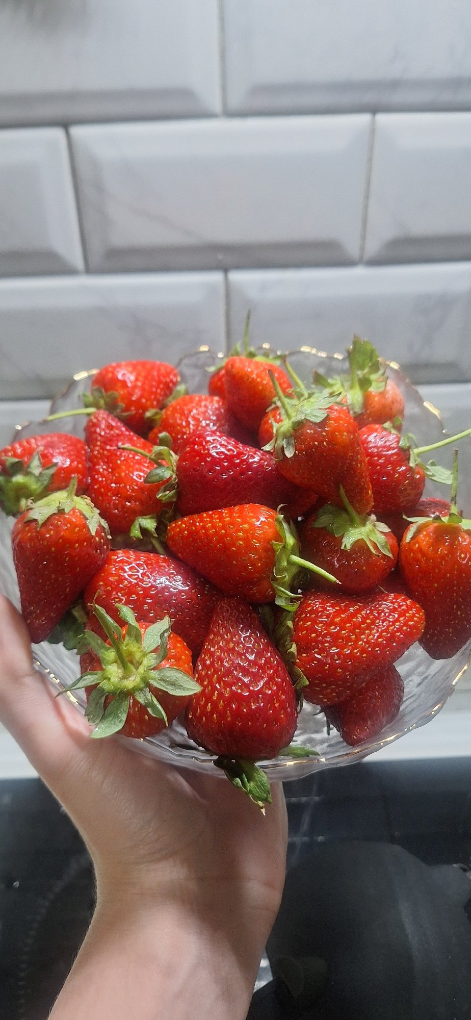 Fresh strawberries displayed in clear container in Moscow