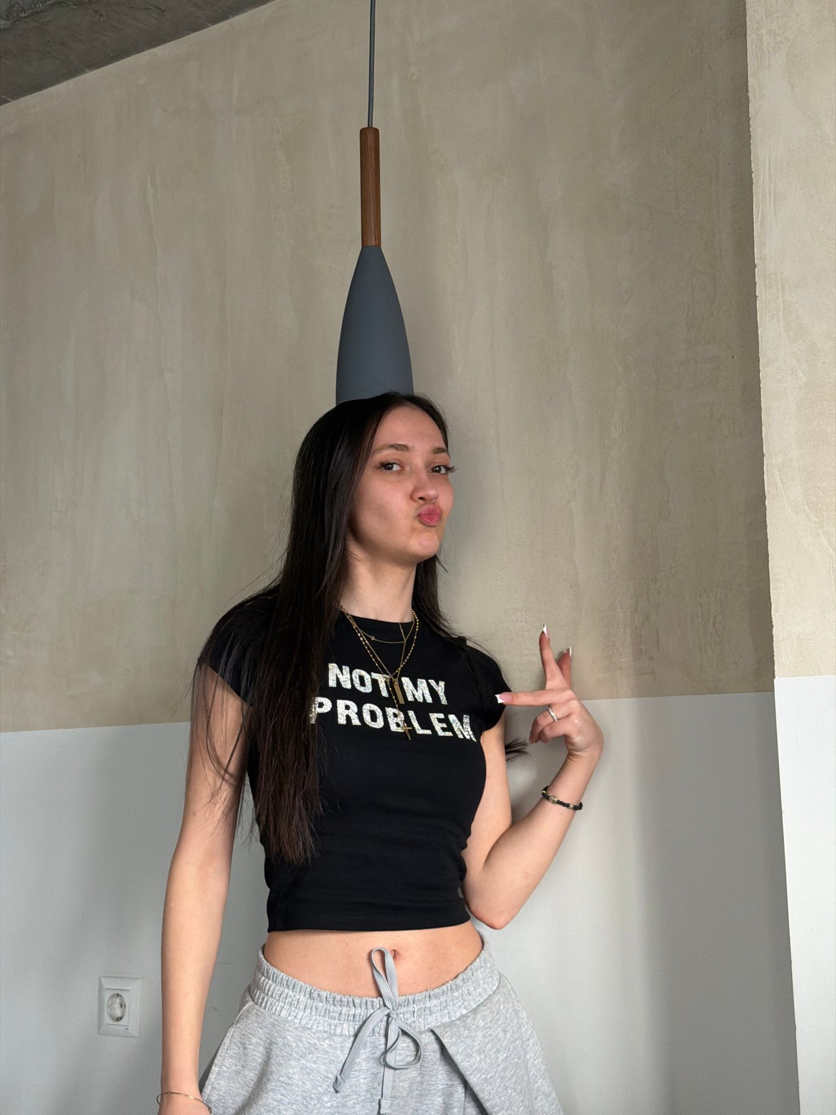 Woman poses in statement shirt across Yerevan, Armenia