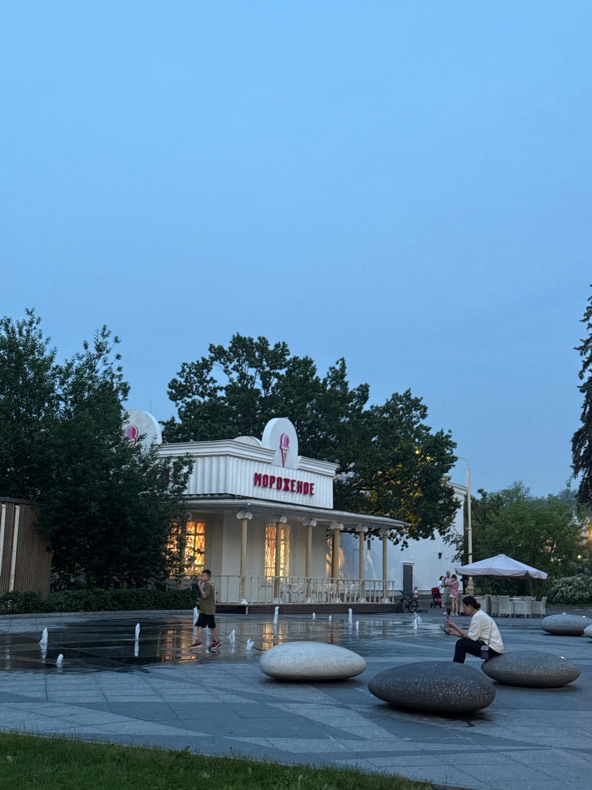 Evening scenes captured near Moscow ice cream stand and orchard