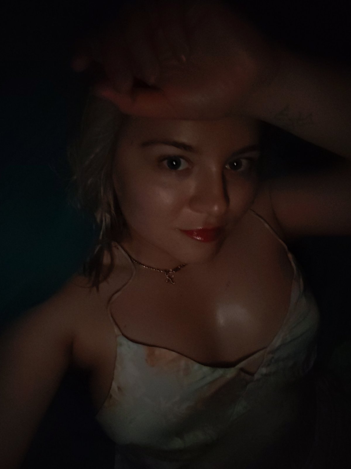 Woman photographed in dimly lit setting in Izhevsk