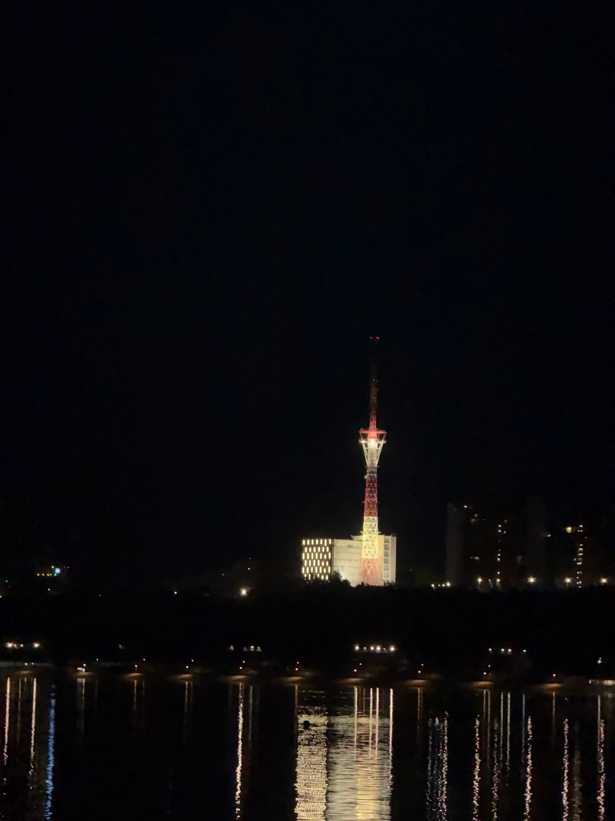Nighttime cityscape reflections captured across Perm's Kama River