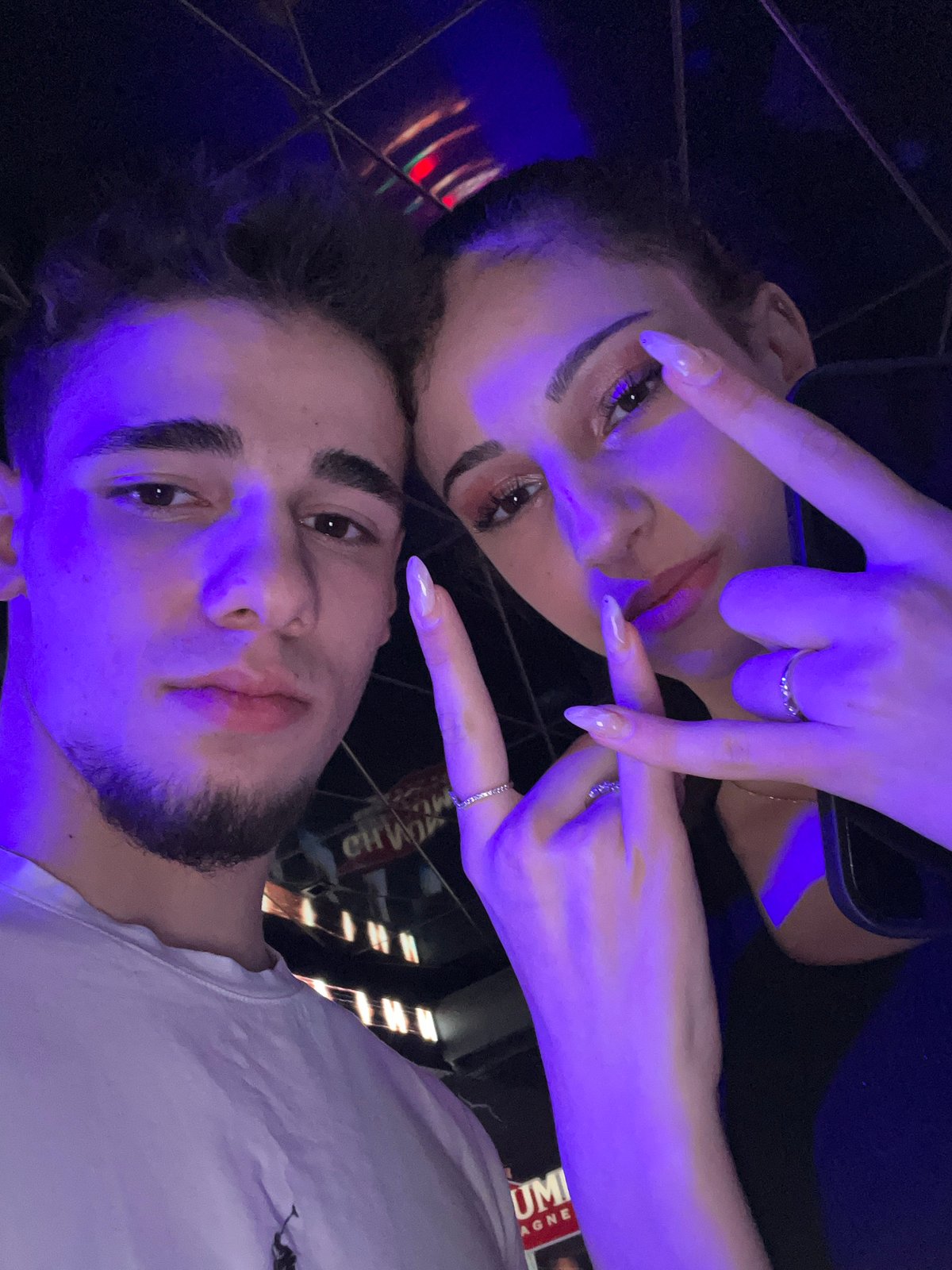Nightclub selfie captured at Sofia bar with cocktails