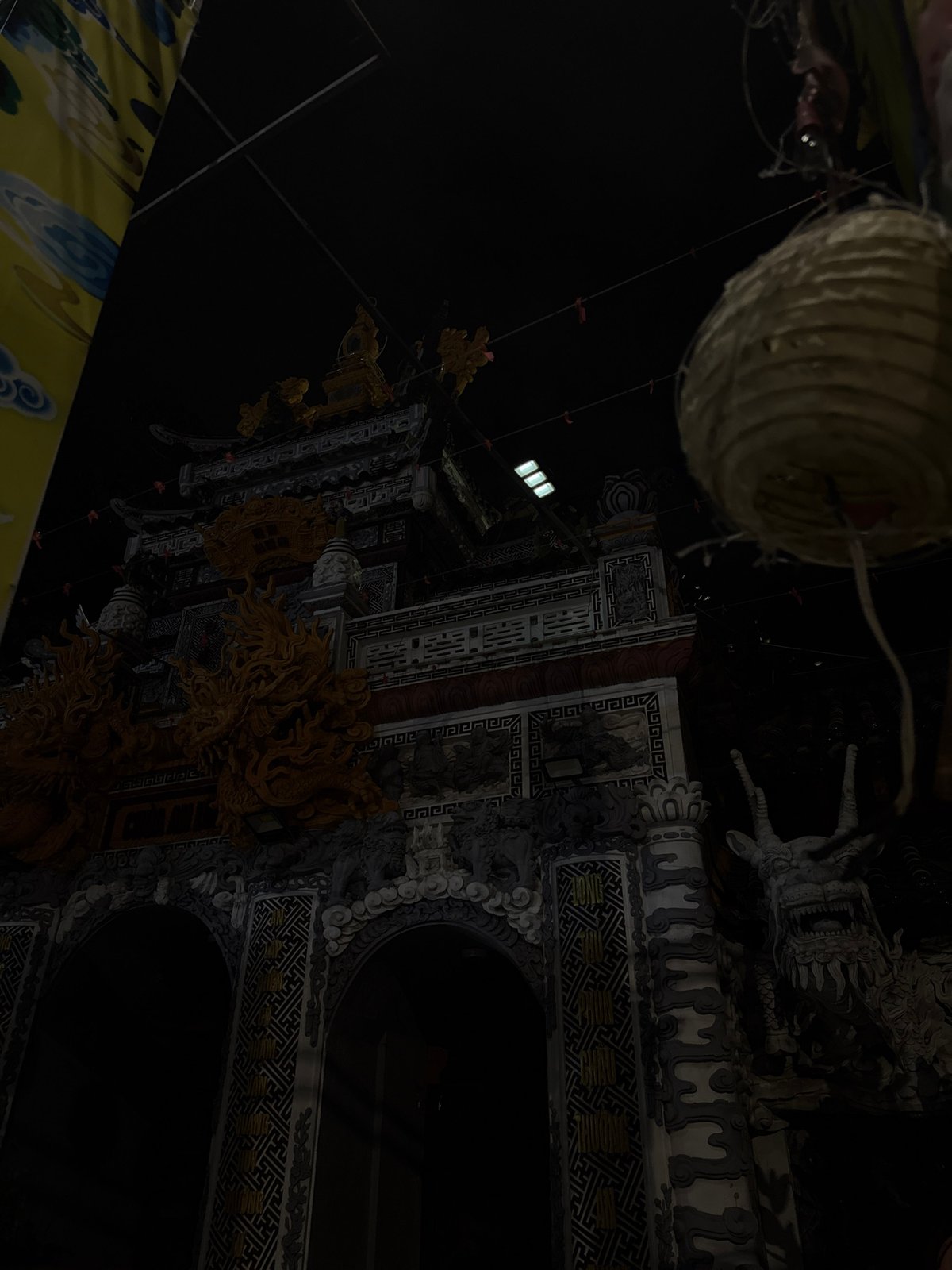 Temple gates, luxury cars, and nightlife in downtown Đà Nẵng