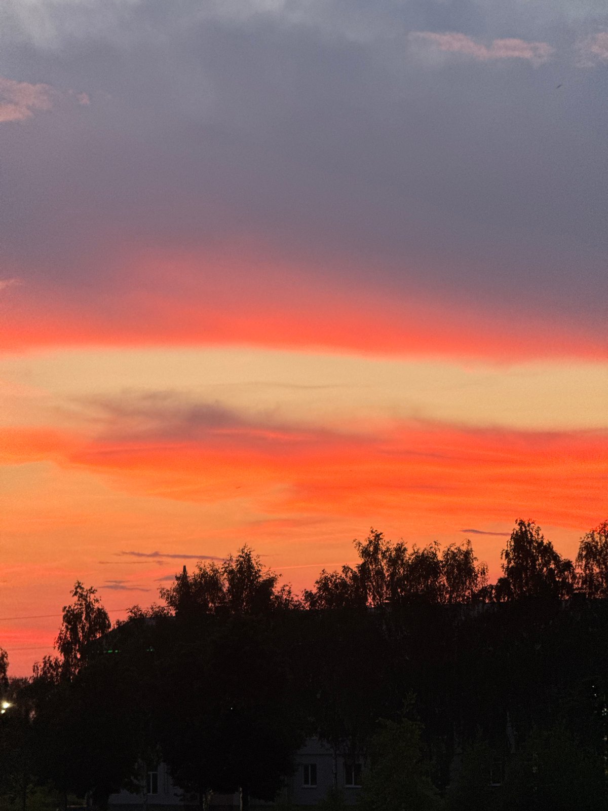 Dramatic sunset illuminates Murom, Russia skies with vibrant colors