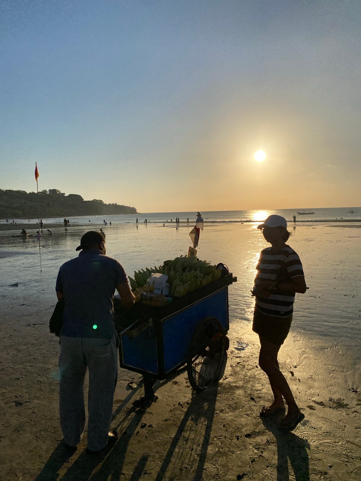 Golden hour beach life in Kuta Selatan, Indonesia