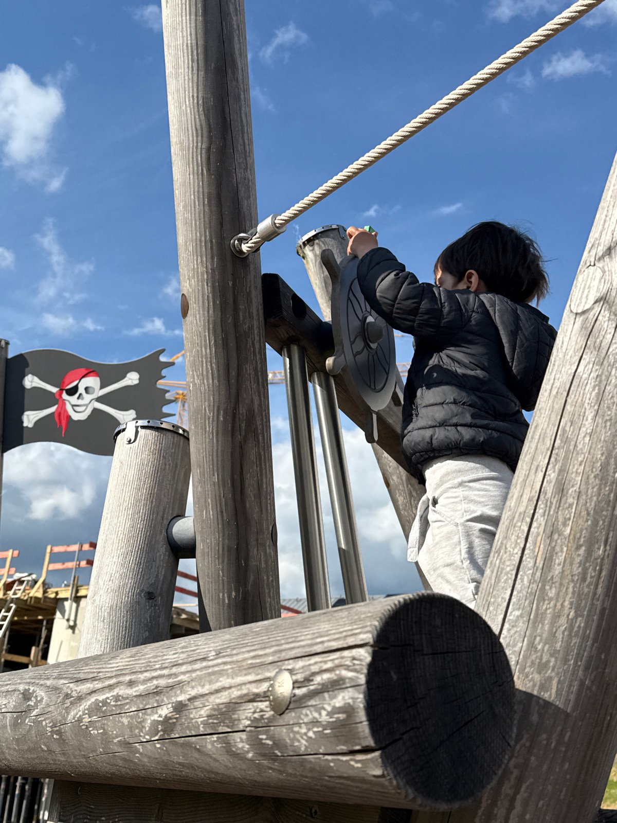 Child plays on pirate playground in Junglinster, Luxembourg