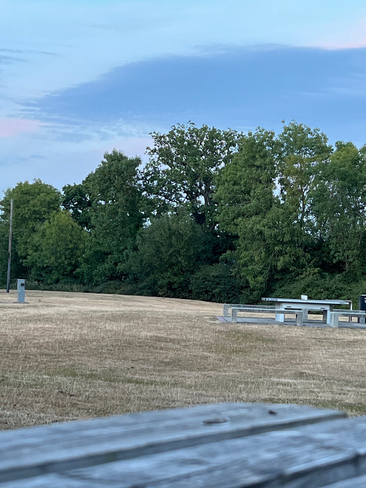 Evening pit stop at a Guildford picnic table with an e-bike