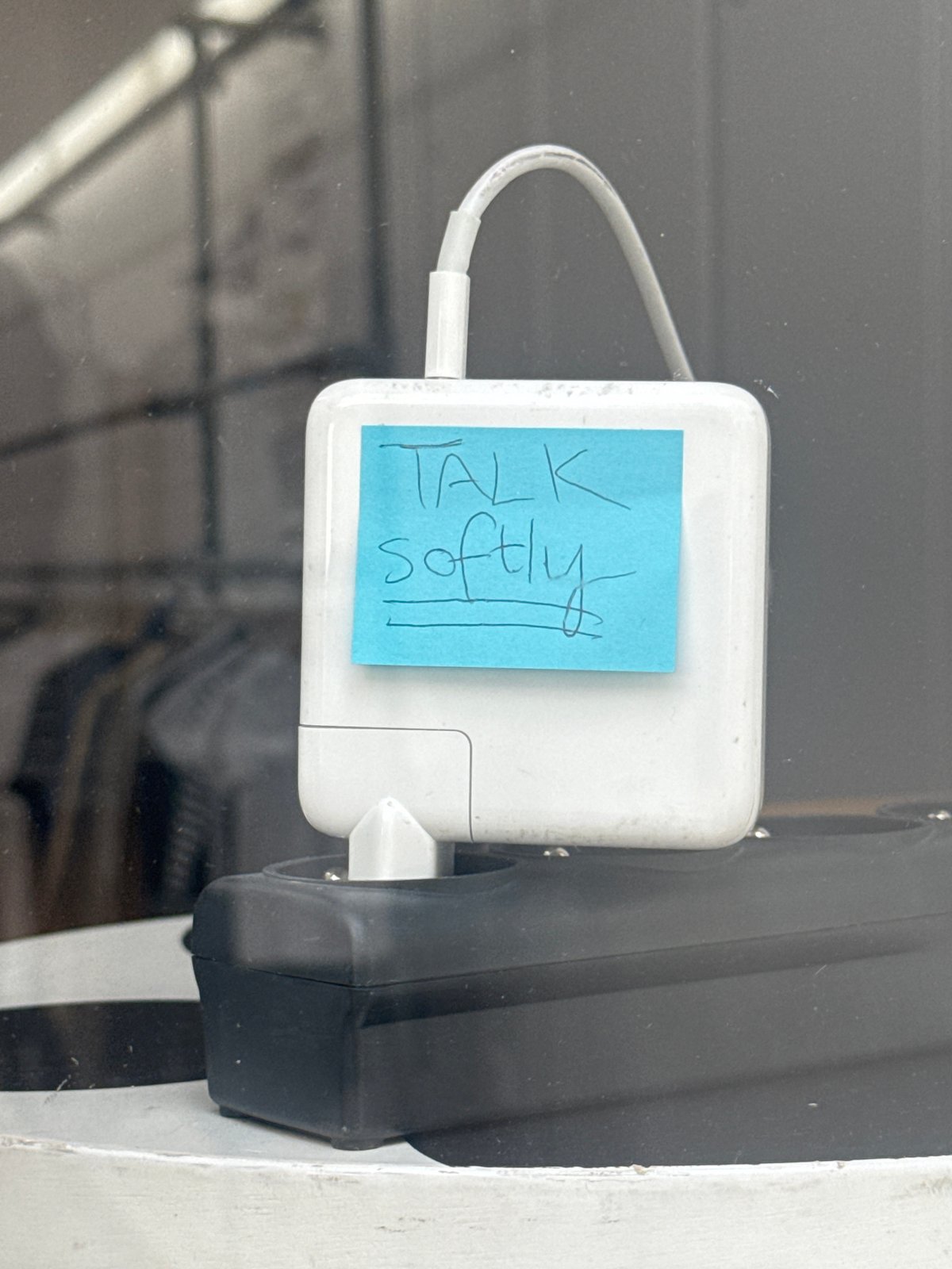 White power adapter observed charging in Paris electrical socket