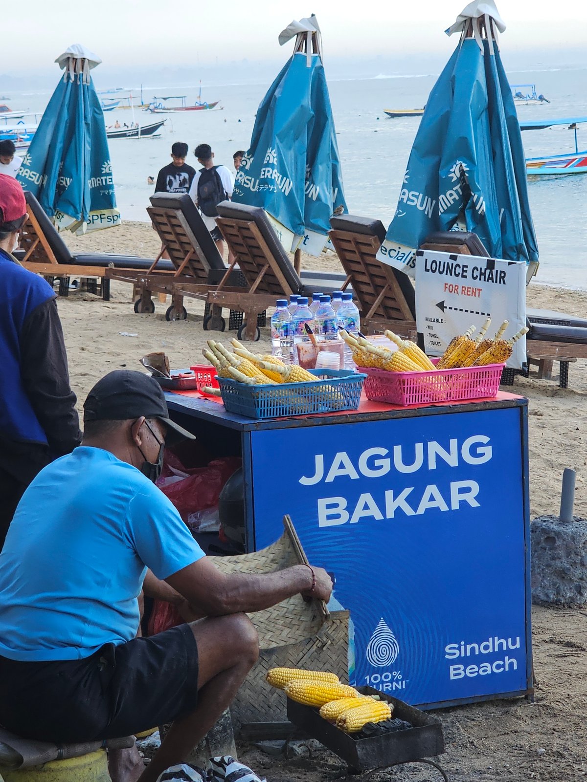 Busy afternoon at Sindhu Beach with vendors and beachgoers