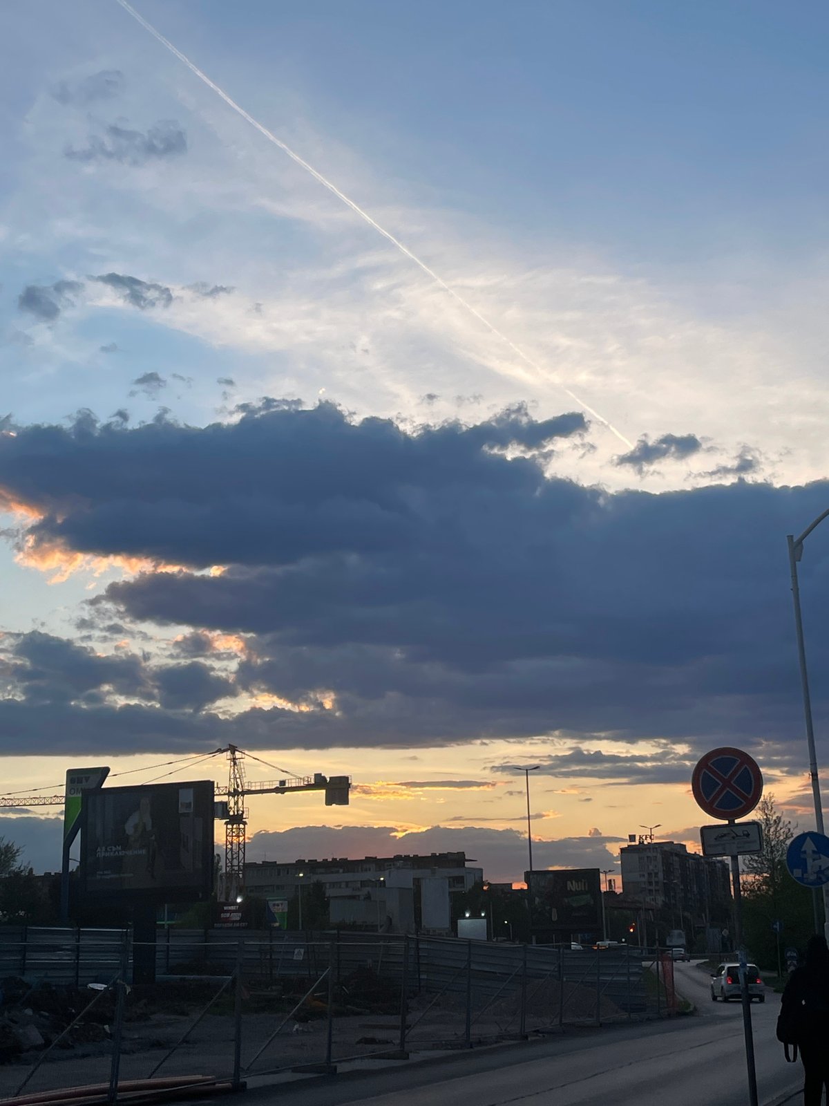 Dramatic sunset contrasts with storm clouds over Sofia streets