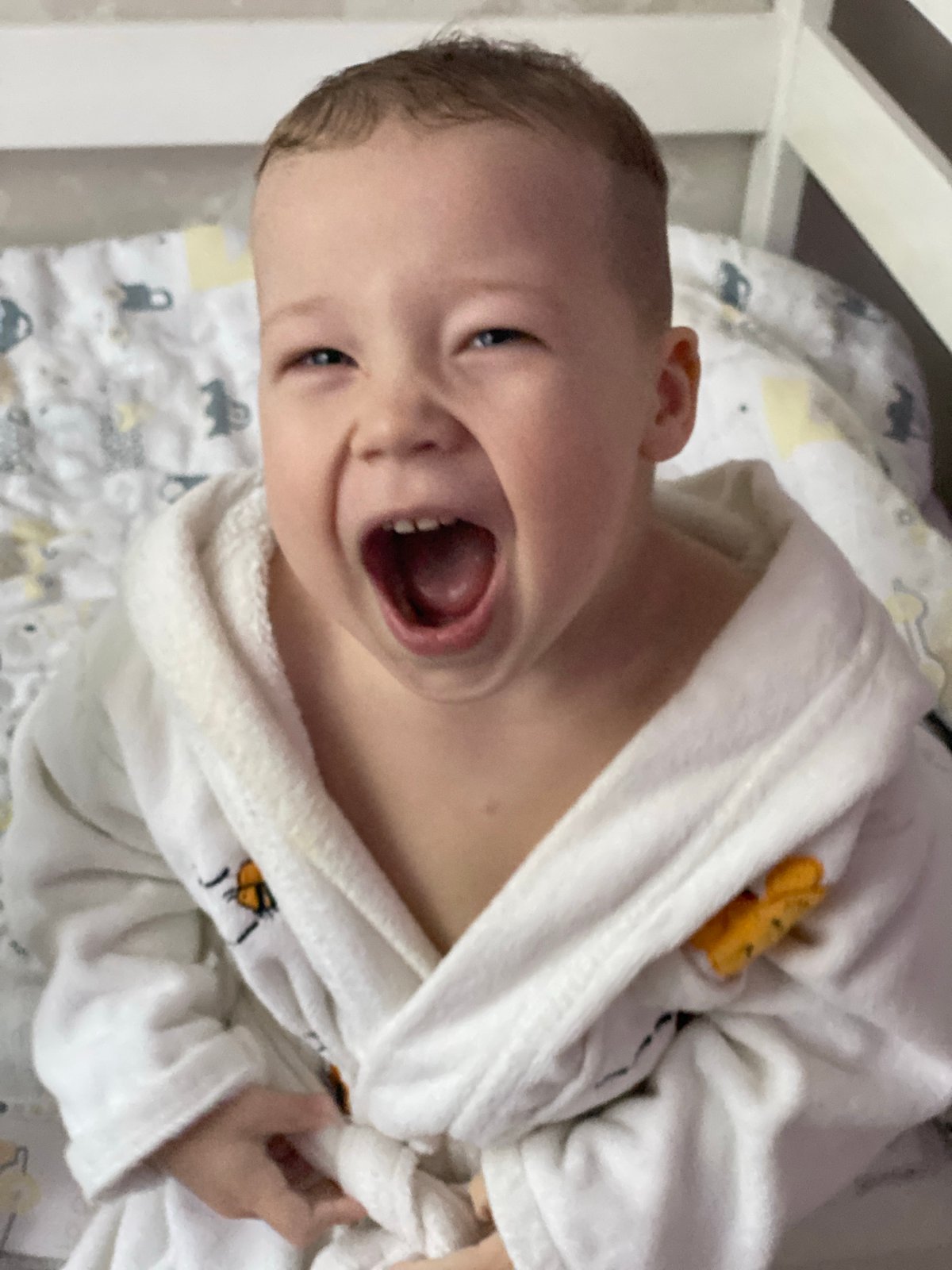 Joyful toddler captured in portrait session in Sochi home