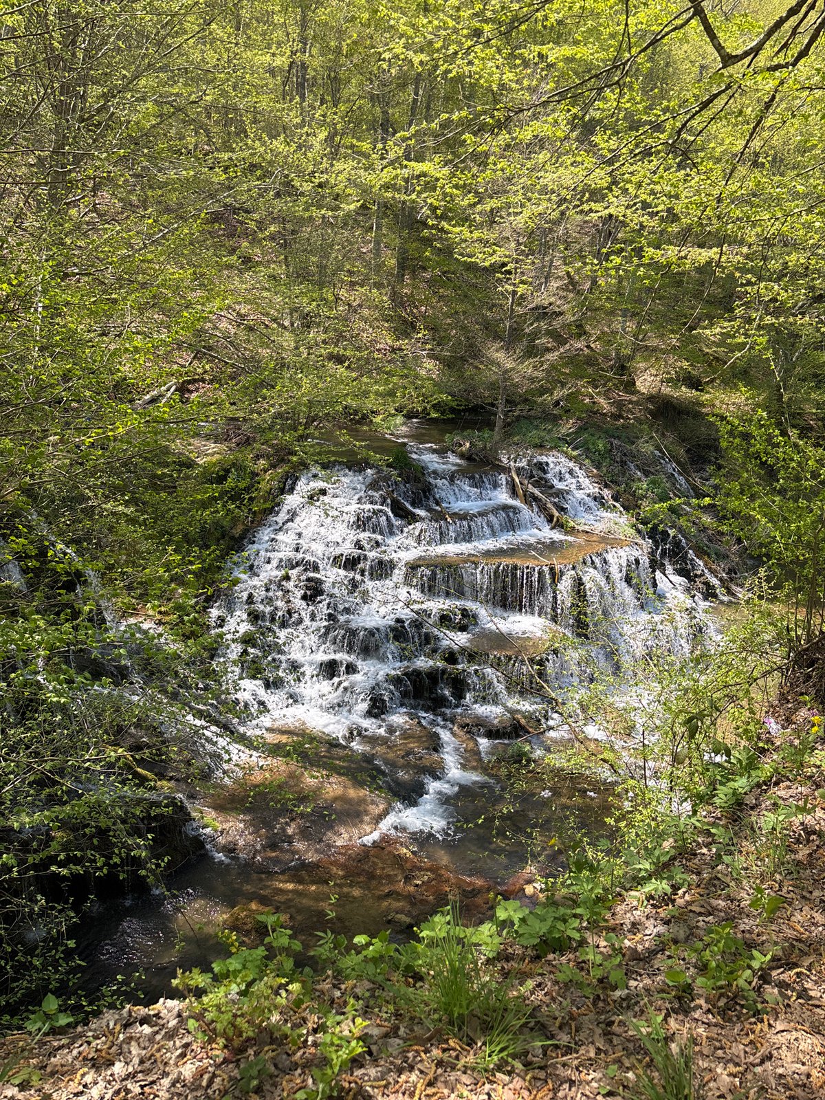 Rural waterfall and traditional houses documented in Stoilovo, Bulgaria