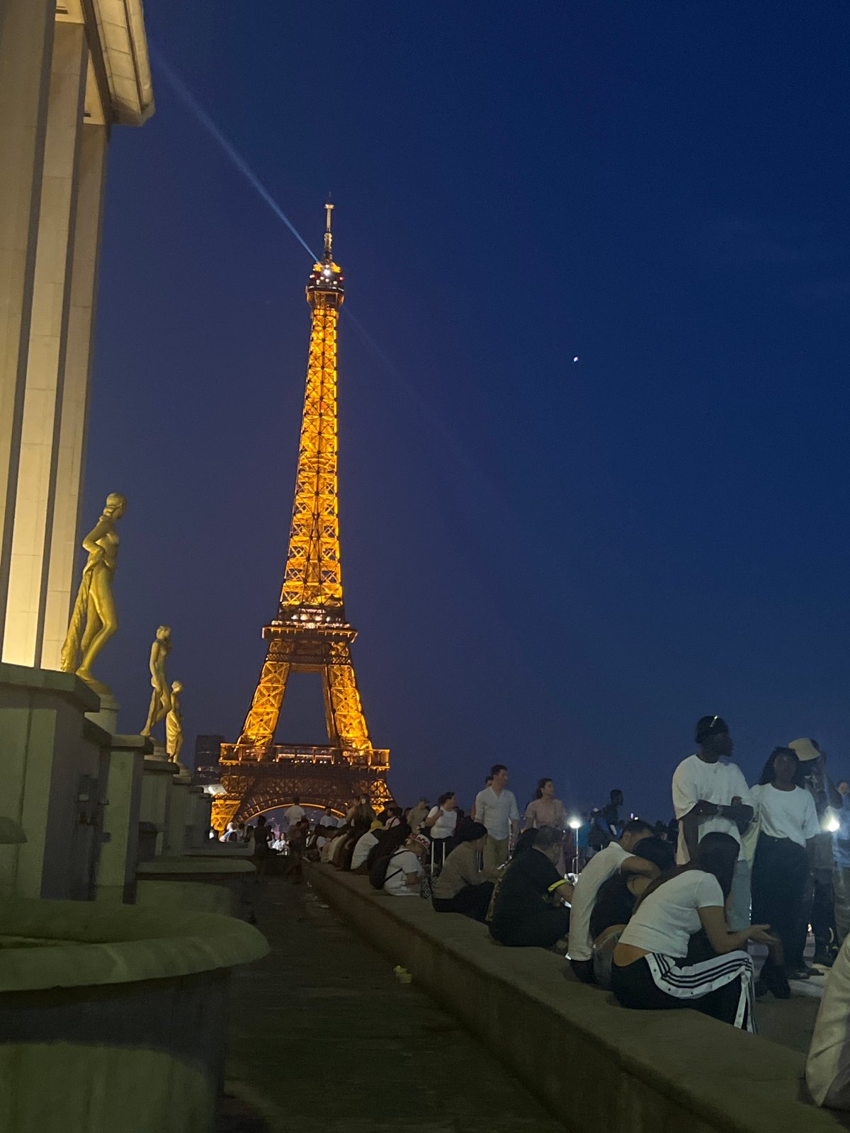 Eiffel Tower glowing at dusk, Paris evening in full effect