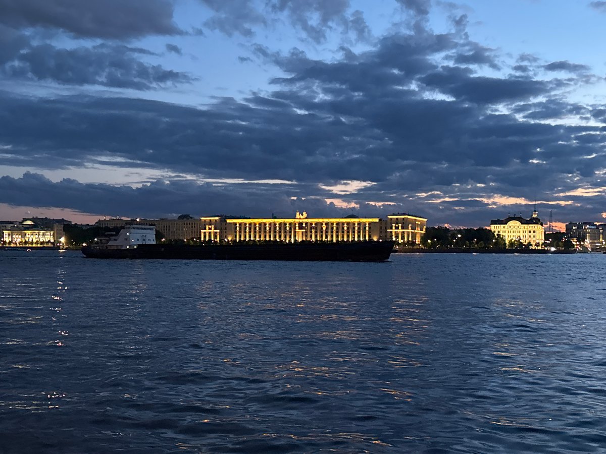 White Nights on the Neva: boats, embankments, and a glowing skyline