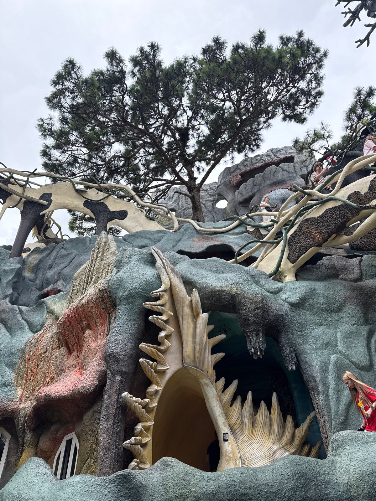Tourist documents whimsical sculptures at Vietnam's Crazy House attraction