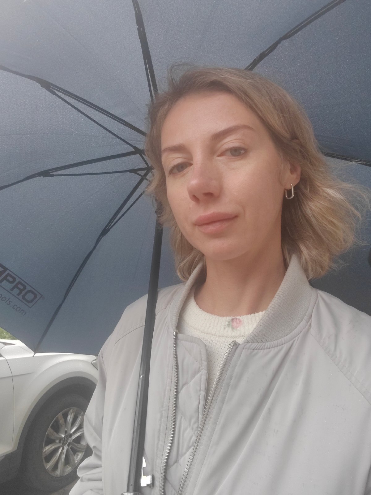 Rainy summer morning stroll in Saint Petersburg, roses blooming nearby