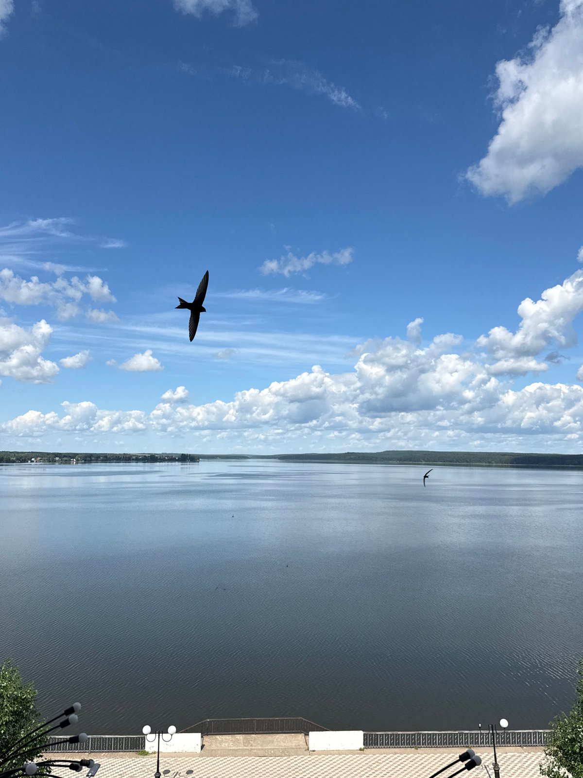 Calm morning at Votkinsk Reservoir under a clear blue sky