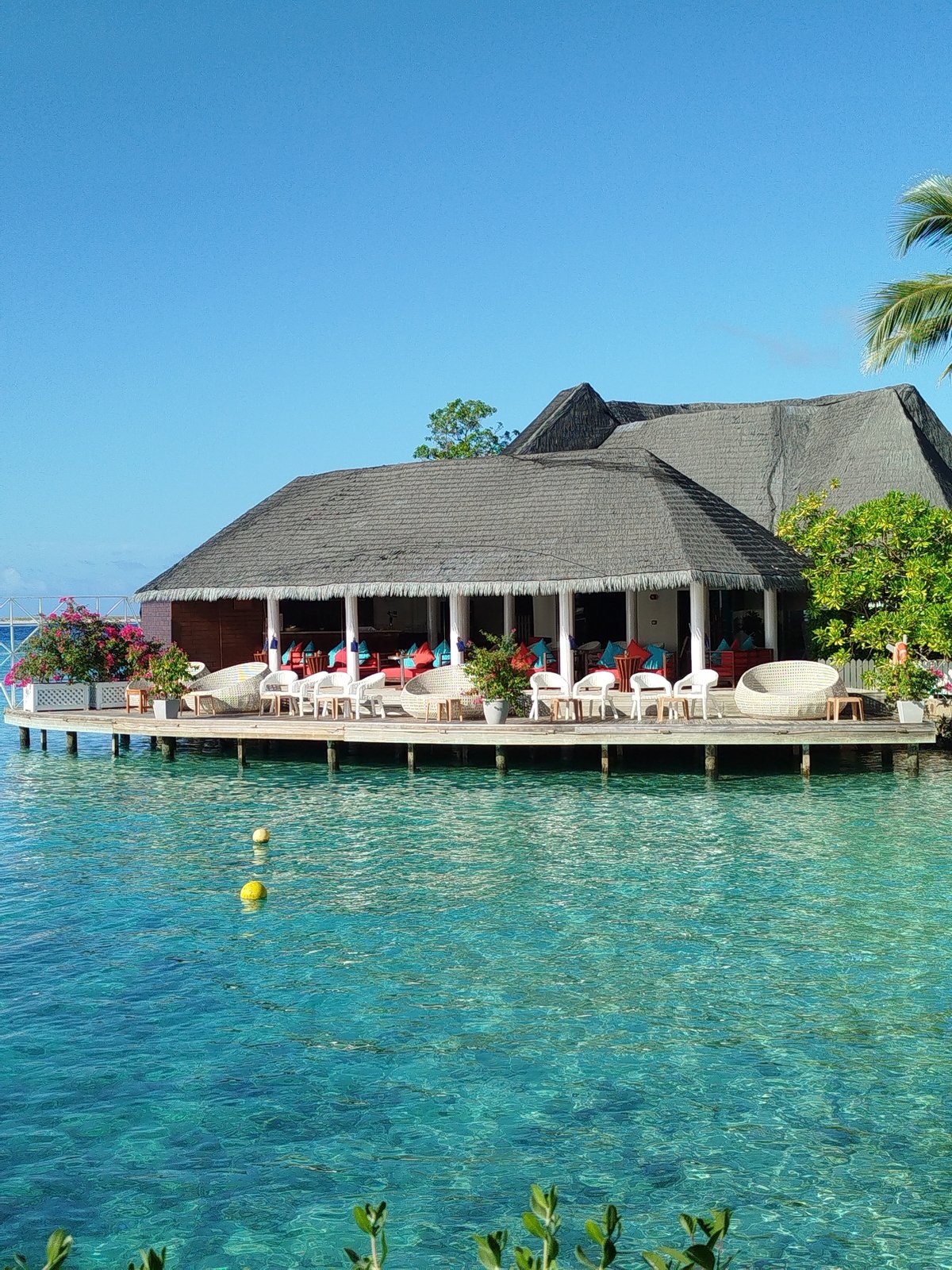 Morning around a Maldives resort: decks, beach swings, and heart ornaments