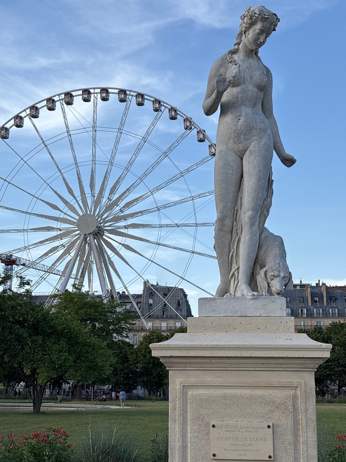 Tuileries sculpture and Ferris wheel on a Paris evening