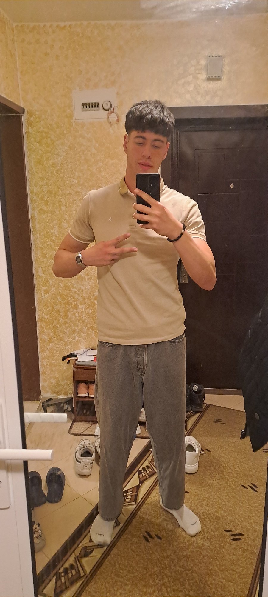 Person takes mirror selfies indoors in Burgas, Bulgaria