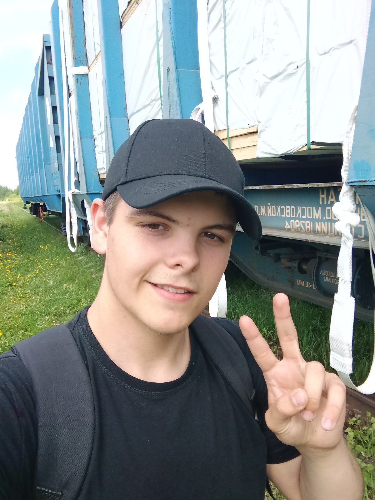 Young man photographed at overgrown railway yard in Andreyevo
