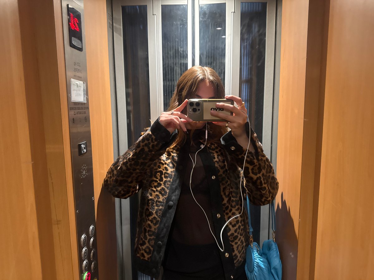 Woman documents Paris visit with elevator selfies, city views